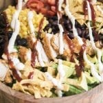 BBQ ranch chicken salad with ranch and bbq sauce drizzled on top.