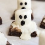 Close up image of ghost brownies with melting white chocolate on top.