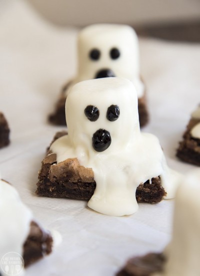 Close up image of ghost brownies with melting white chocolate on top.