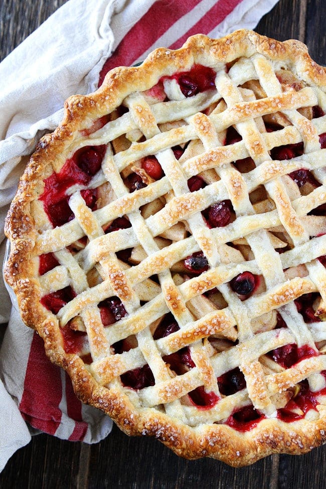 An apple cranberry pie with a lattice topping.