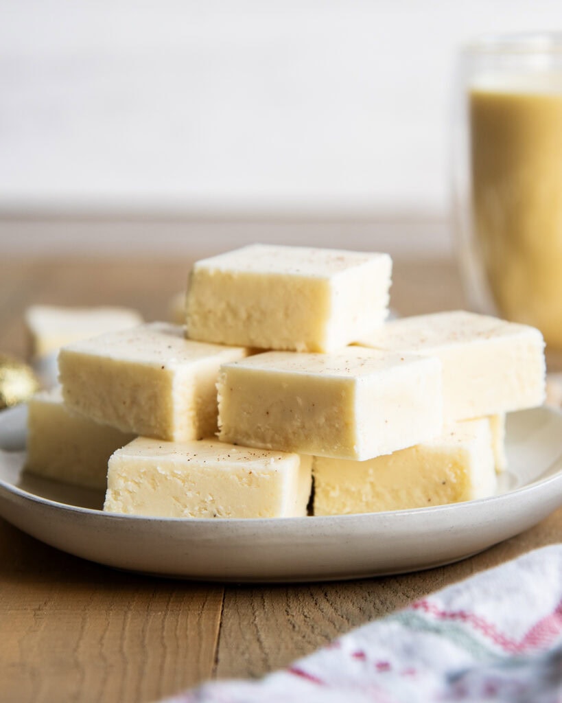 A plate of pieces of eggnog fudge.