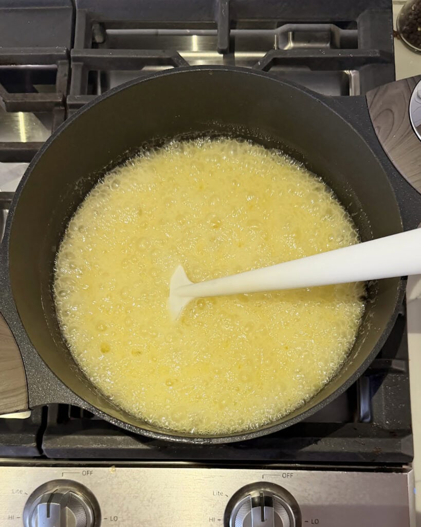 Boiling sugar in a pot.