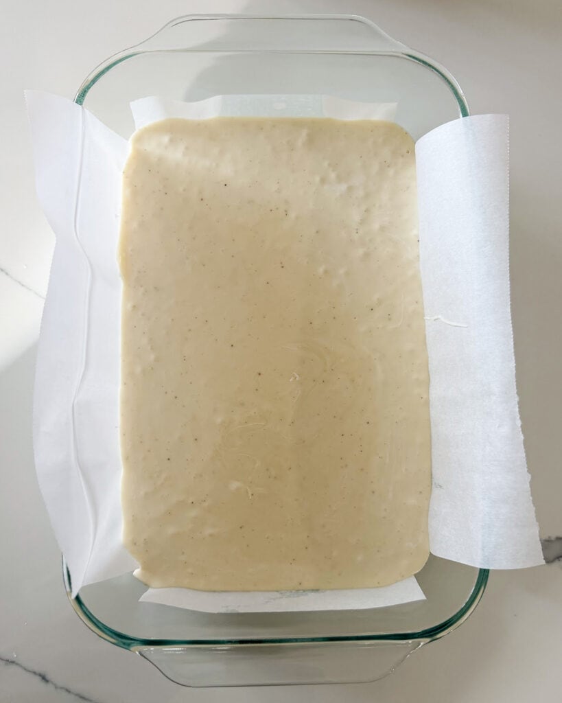 A glass pan full of eggnog fudge.