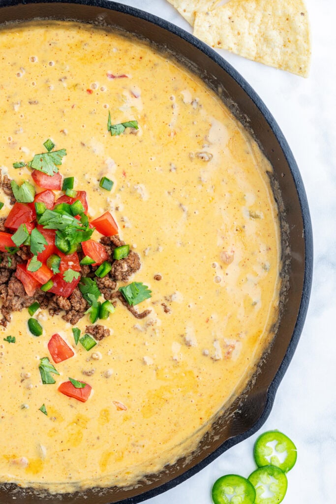 A close up of a skillet of beef queso dip.