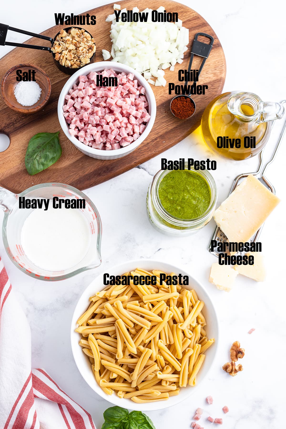 A labeled photo of the ingredients needed to make Casarecce Pasta with Pesto