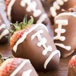 A strawberry dipped in chocolate and decorated to look like a football.
