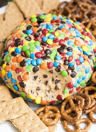 A dessert cheeseball covered in mini m&ms.