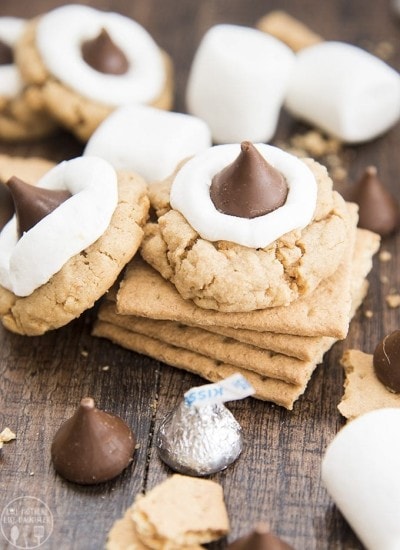 A stack of graham crackers with a peanut butter s'mores cookie on top.