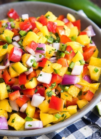 A bowl of fresh mango and bell pepper salsa.