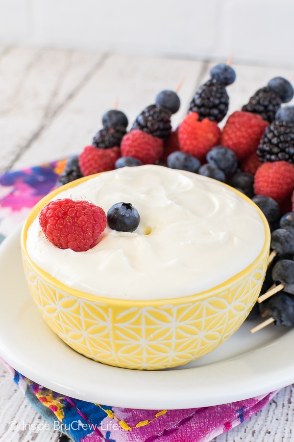 A lemon fruit dip in a yellow bowl. 