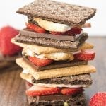 A stack of s'mores made with strawberries in them.