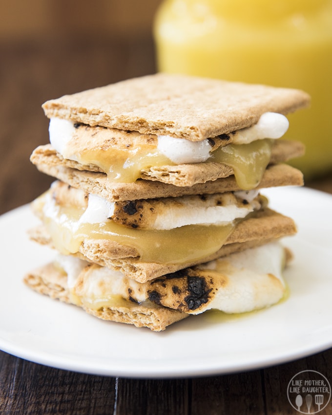 A stack of s\'mores made with lemon curd and marshmallows on a plate. 