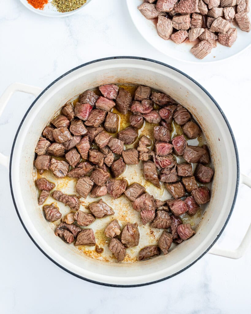 Seared steak chili in a large pot.