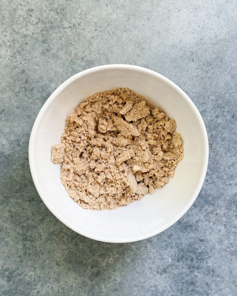 A crumbly brown streusel topping in a bowl.