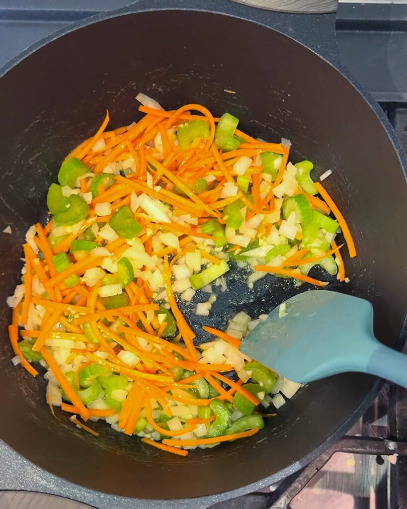 Vegetables sauteeing in a pan.