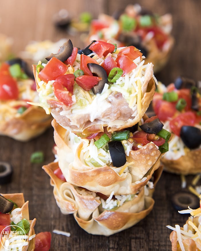 Angled view of 7 layer dip wonton cups.