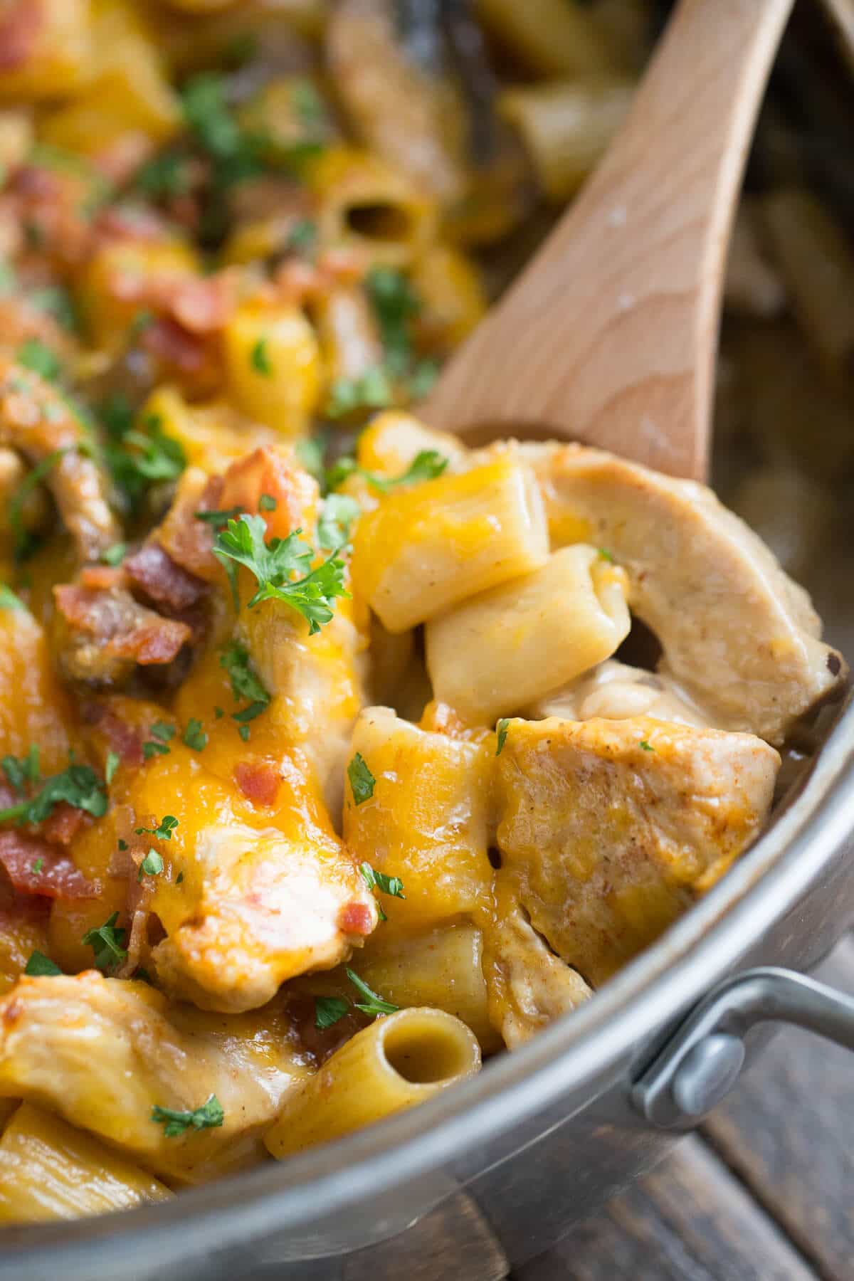 Chicken and Pasta covered with cheese and bacon.