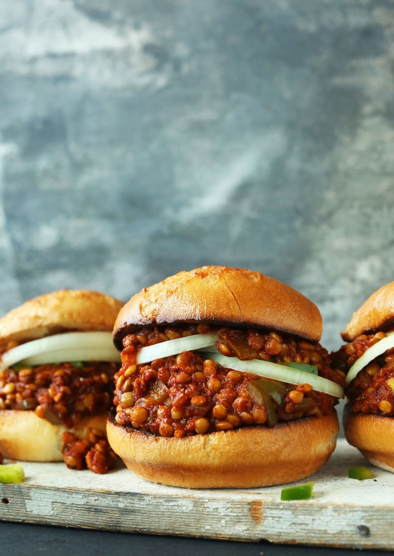 Vegan sloppy joes topped with onions. 