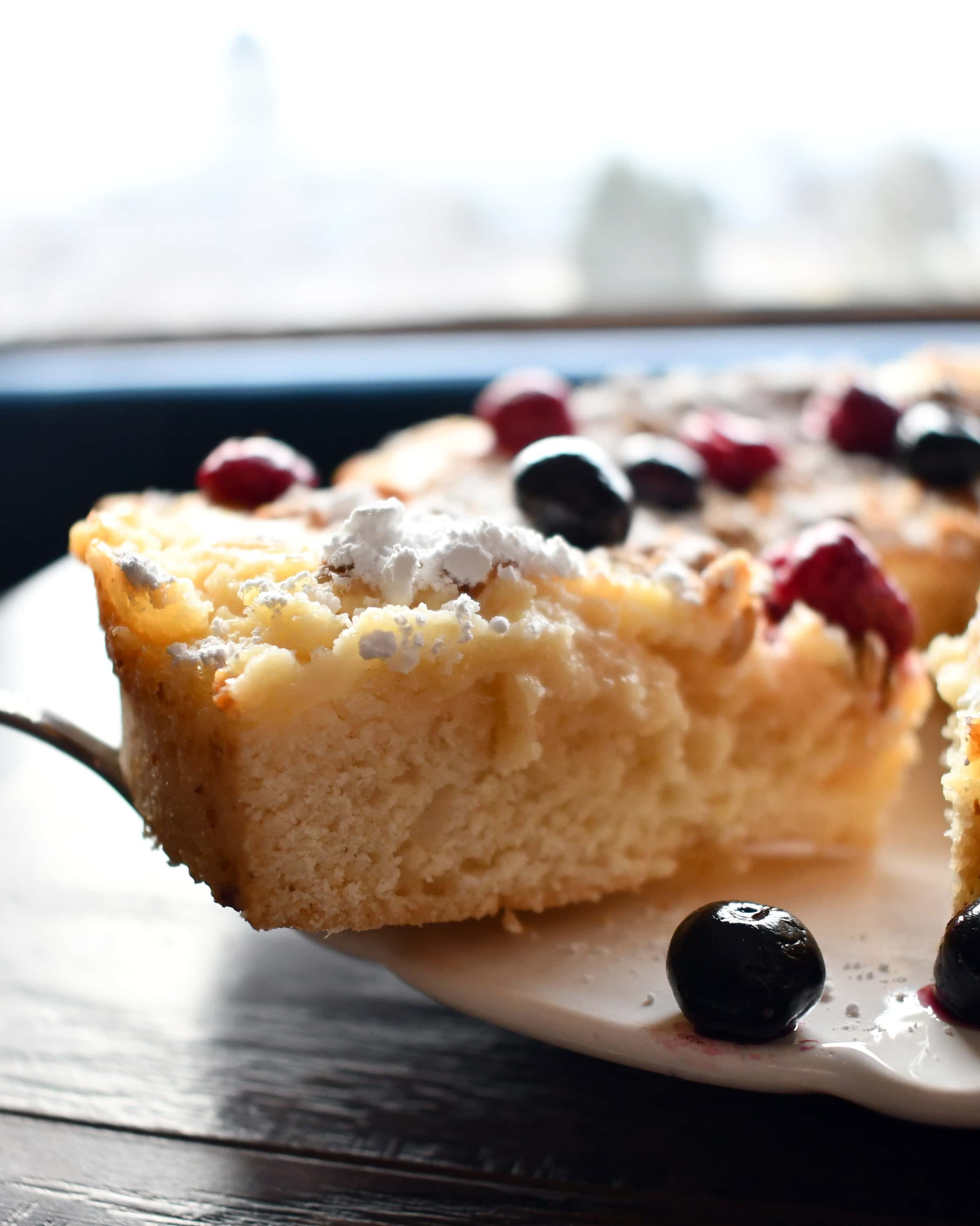 Lemon ricotta cake with the perfect deliciousness of creamy ricotta, tart lemon curd, and sweet cake baked together