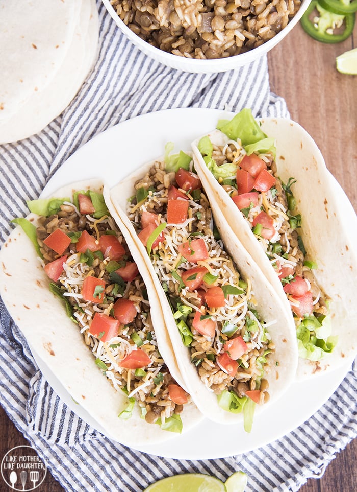 An overhead photo of three lentil and brown rice tacos. 
