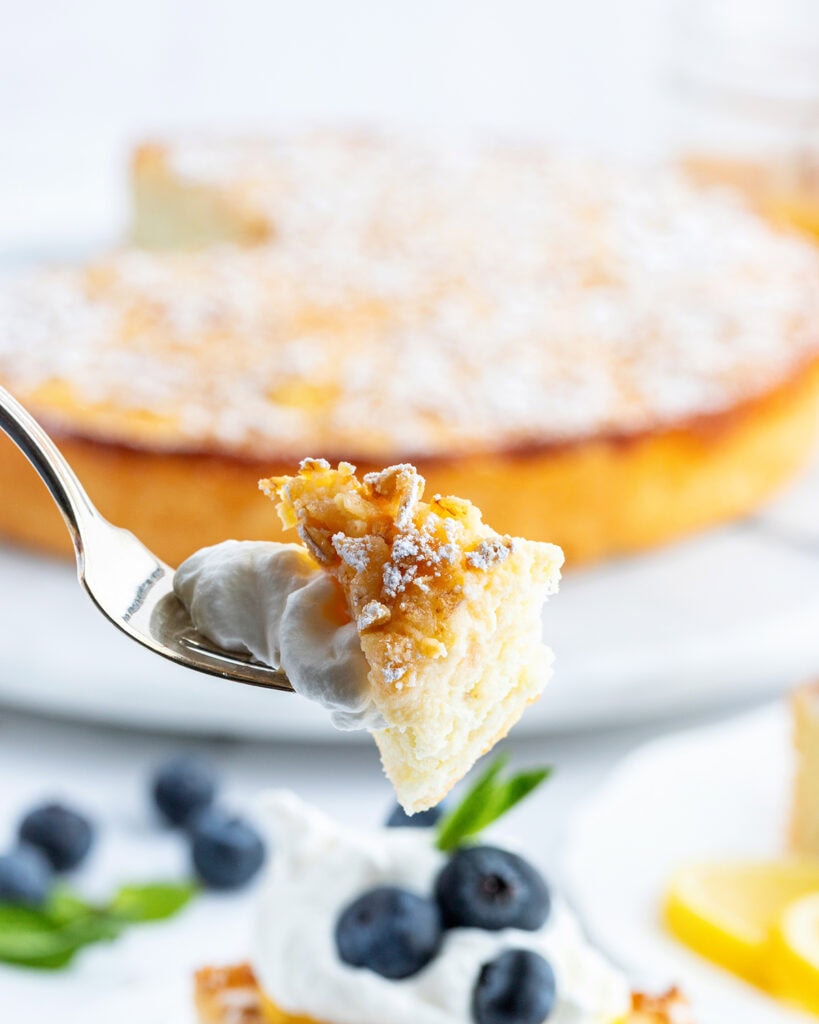 A bite of ricotta cake on a fork.
