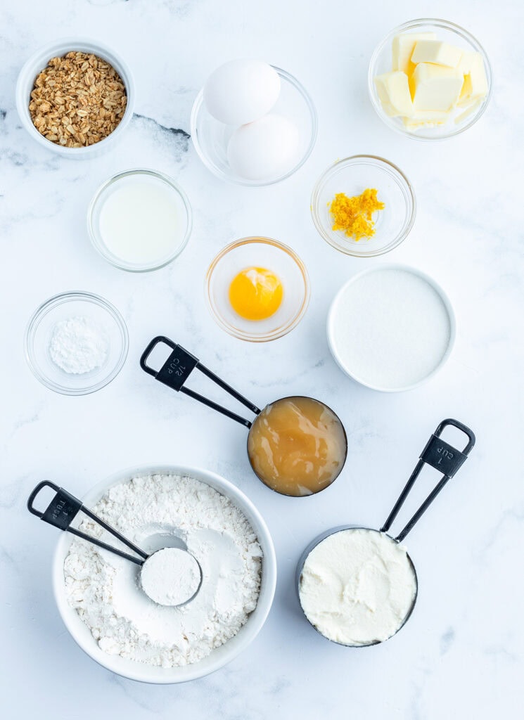 Bowls of the ingredients needed to make lemon ricotta cake.