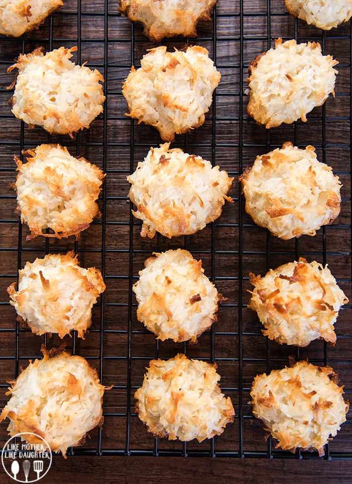 Coconut macaroons in rows on a cooling rack. 