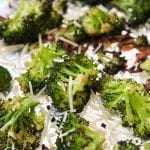 Roasted broccoli topped with shredded parmesan cheese.