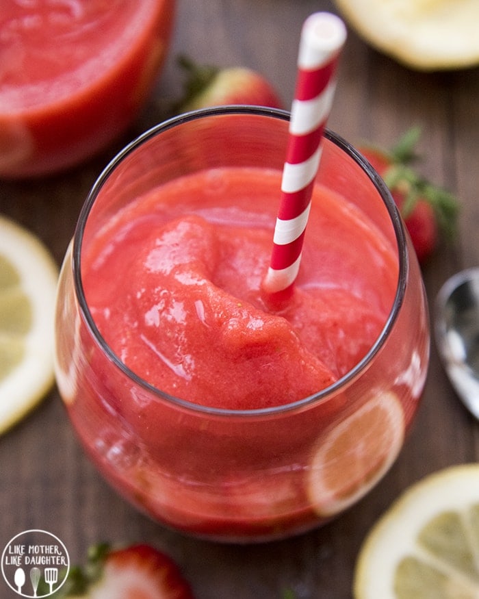 A glass full of frozen strawberry lemonade.