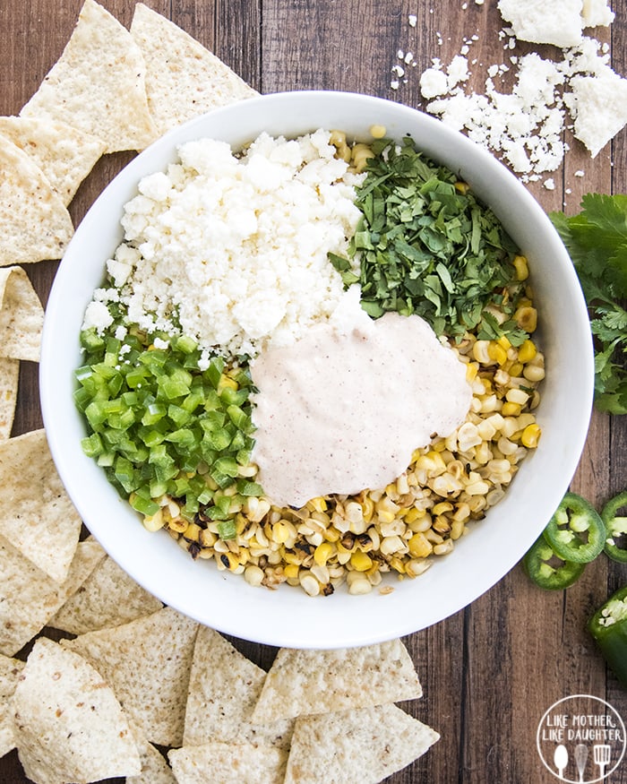 Mexican Street Corn dip with cotija cheese, cilantro, diced jalapeno and a creamy sauce.
