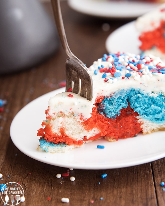 Red White and Blue Cake topped with buttercream frosting.