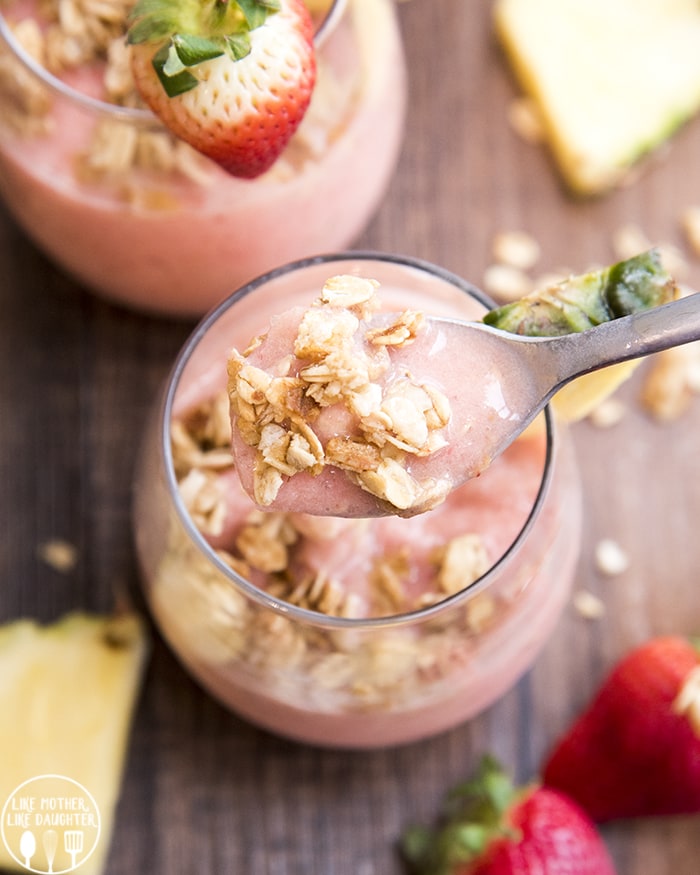A breakfast smoothie topped with granola for the perfect crunch