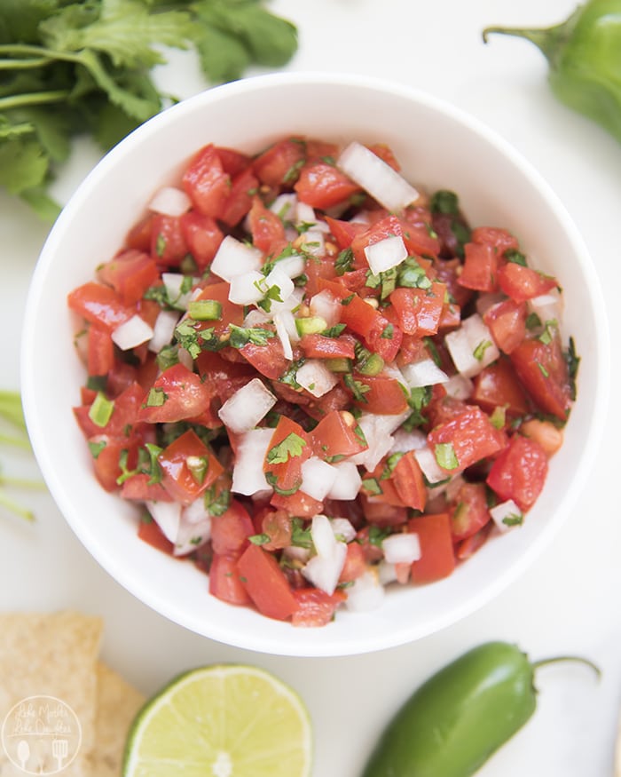 Huevos Rancheros with refried black beans, egg, salsa, pico de gallo and cotilla cheese!