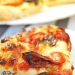 Angled view of roasted tomato mini pizzas.