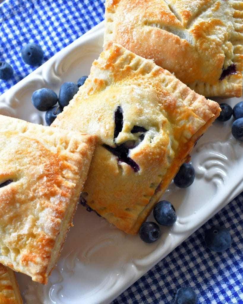 Hand held blueberry pies.