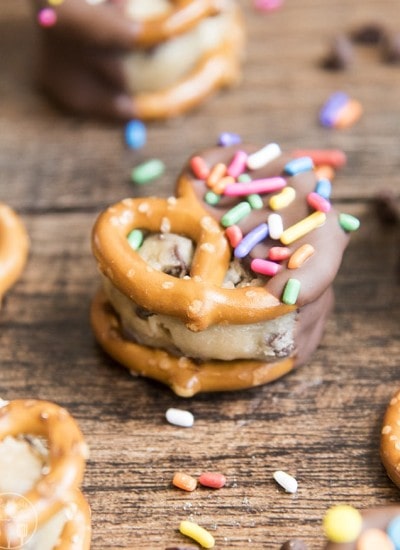 Two pretzels stuffed with cookie dough and dipped in chocolate.