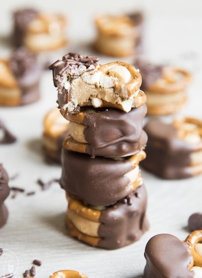 A stack of peanut butter buckeye pretzel bites dipped in chocolate.