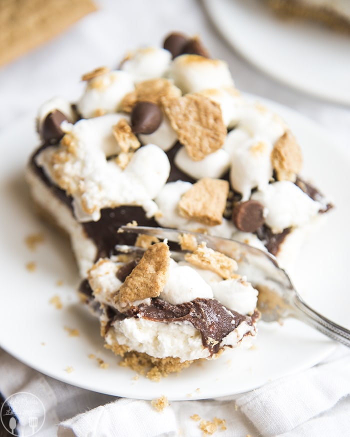 Smores Cheesecake with graham cracker, chocolate and toasted marshmallows