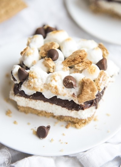 A piece of no bake smores cheesecake on a plate.