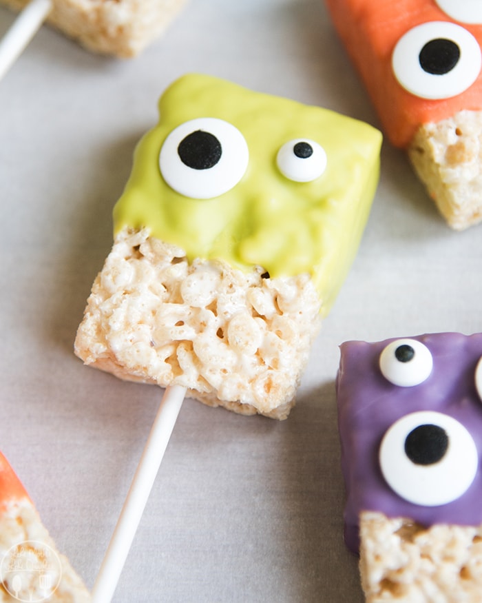 A green monster rice krispie treat with two candy eyes.