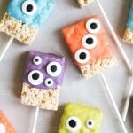 Monster rice krispie treats decorated with candy melts and googly eyes.