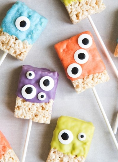Monster rice krispie treats decorated with candy melts and googly eyes.