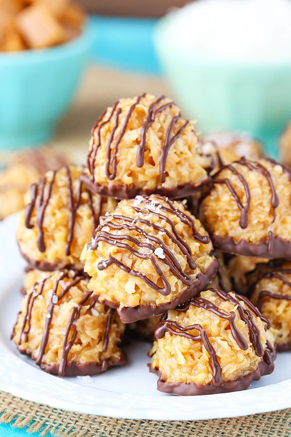 A plate of salted caramel coconut macaroons drizzled with chocolate. 