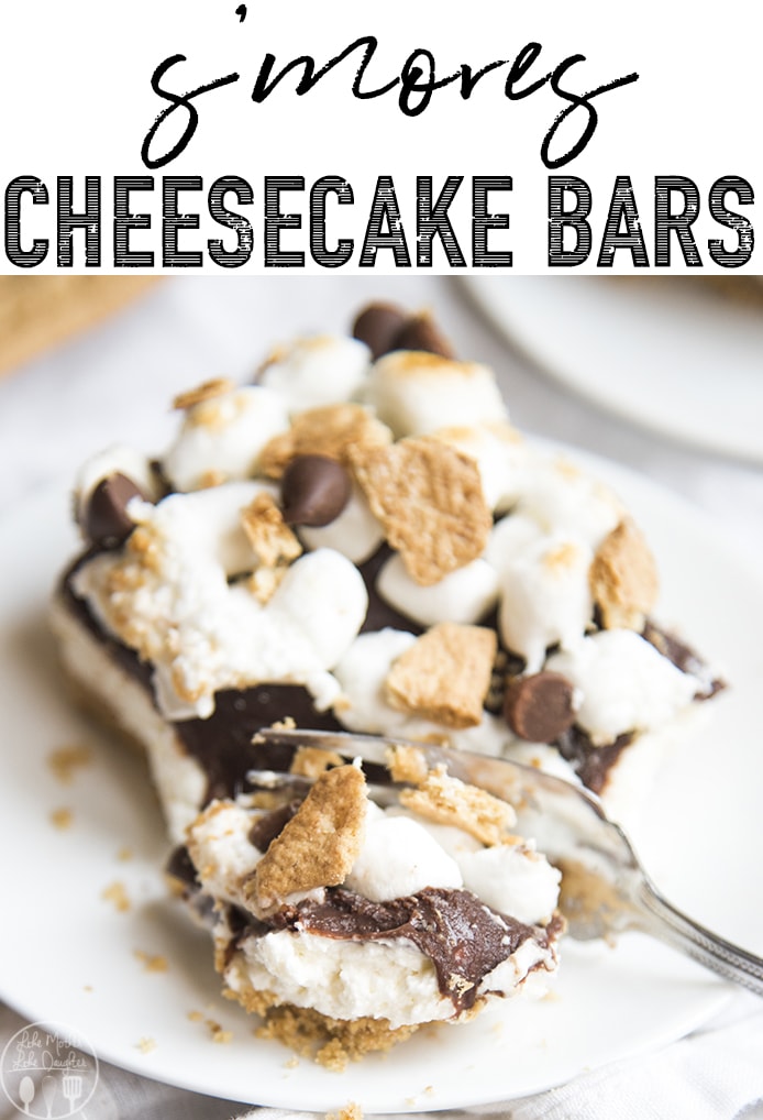 A slice of no bake cheesecake topped with chocolate ganache, and toasted marshmallows.