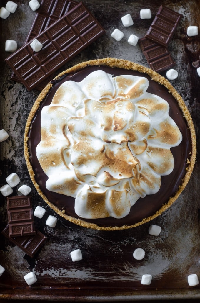 An overhead photo of a smores pie topped with toasted marshmallow fluff.