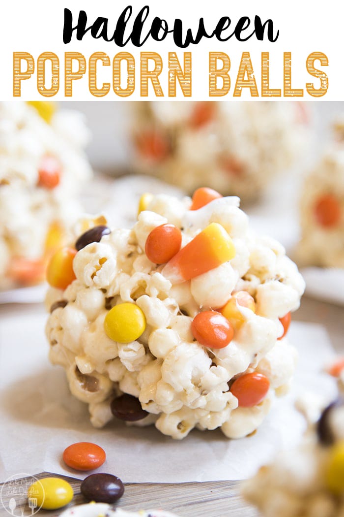 Halloween popcorn balls with reeses pieces and candy corn in them. 