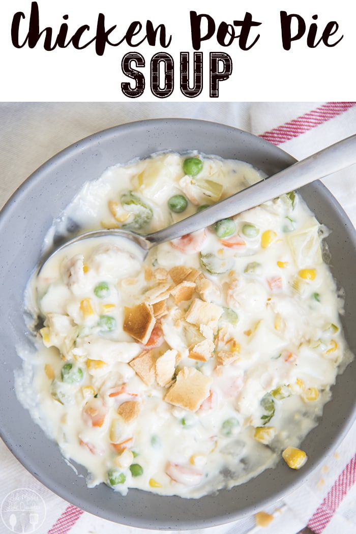 A bowl of chicken pot pie soup with a spoon in it.