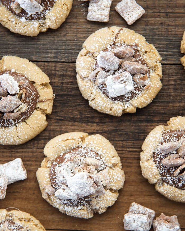 Muddy buddy cookies on a wooden board.