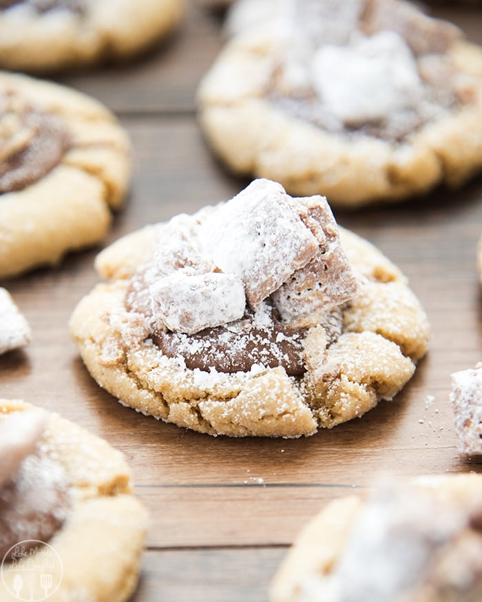 Peanut butter muddy buddie cookies with actual muddy buddy pieces on top.