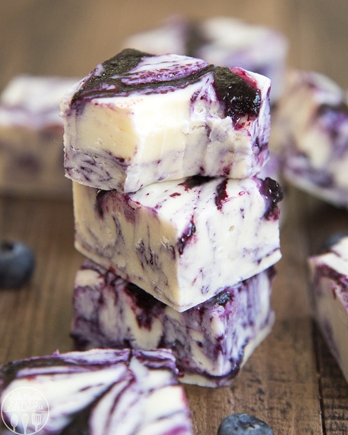 A stack of three pieces of blueberries and cream fudge.